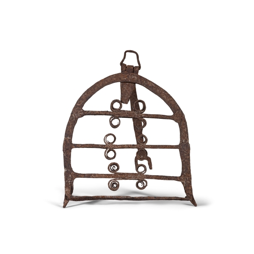 207 - AN IRISH WROUGHT IRON D-SHAPED HARNAN STAND   the open pane decorated with paired scrolls with hinge... 