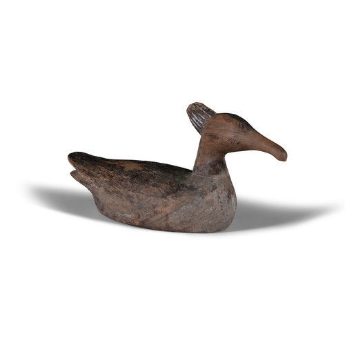 212 - A BROWN PAINTED AND CARVED WOODEN DUCK DECOY   with crown top. 16cm high, 34cm long, 13cm wide,