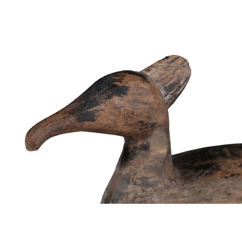 212 - A BROWN PAINTED AND CARVED WOODEN DUCK DECOY   with crown top. 16cm high, 34cm long, 13cm wide,