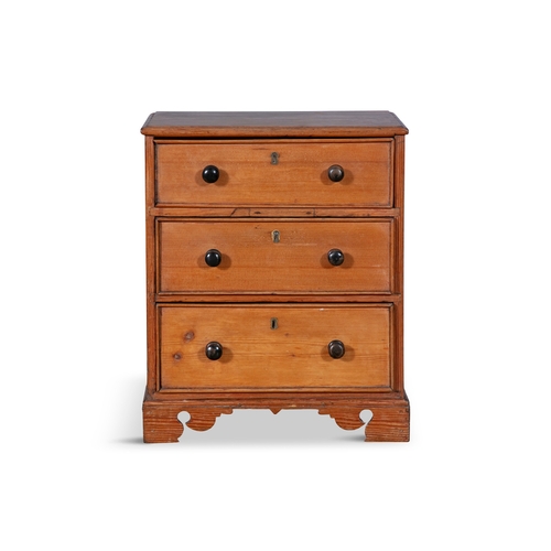 223 - A STAINED PINE APPRENTICE CABINET MAKER’S MINIATURE CHEST OF DRAWERS, 19TH CENTURY,  the moulded top... 