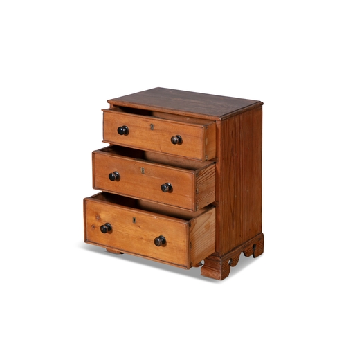 223 - A STAINED PINE APPRENTICE CABINET MAKER’S MINIATURE CHEST OF DRAWERS, 19TH CENTURY,  the moulded top... 