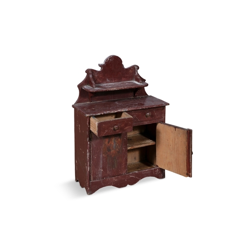 234 - A 19TH CENTURY RED PAINTED TIMBER SCALE MODEL OF AN IRISH CUPBOARD,  the wavy gallery back with shap... 