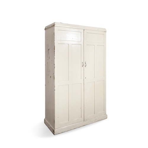 241 - A WHITE PAINTED CUPBOARD,  moulded top above five coffered panel doors enclosing a fitted interior  ... 