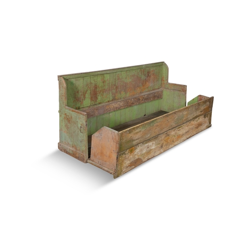 29 - A 19TH CENTURY VARIEGATED GREEN PAINTED PINE SETTLE BED,  the slatted back above a plain seat, hinge... 