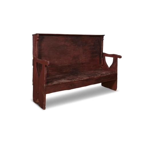 31 - A 19TH CENTURY PAINTED SETTLE BENCH,  the high panel back with carved shaped supports above a plain ... 