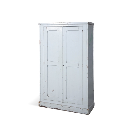 51 - A PAINTED PINE CUPBOARD,  the moulded top and two long panel doors with fitted interior raised on a ... 