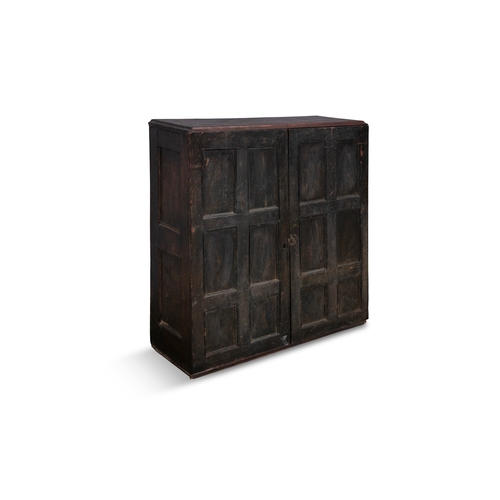 53 - A STAINED PINE HANGING CUPBOARD,  of rectangular form the twin fielded panel doors with six panels e... 