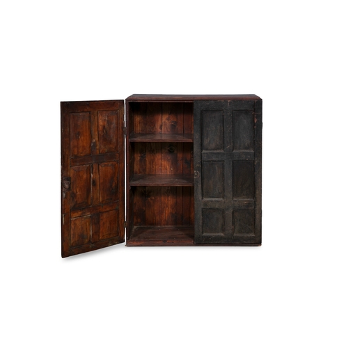 53 - A STAINED PINE HANGING CUPBOARD,  of rectangular form the twin fielded panel doors with six panels e... 