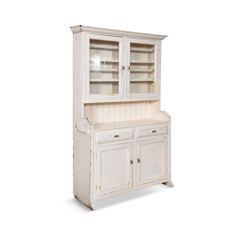 55 - AN EARLY 20TH CENTURY WHITE PAINTED DRESSER,  moulded top above a cabinet with two glazed doors encl... 