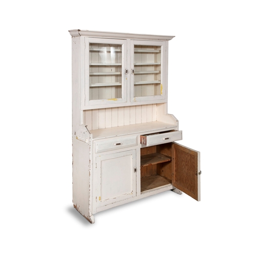 55 - AN EARLY 20TH CENTURY WHITE PAINTED DRESSER,  moulded top above a cabinet with two glazed doors encl... 