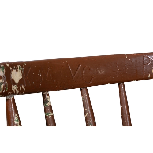 64 - A PAINTED TIMBER HEDGE CHAIR  the carved rail back with inscribed initials on spindles with plain ar... 