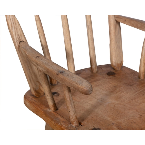 72 - A STAINED TIMBER HEDGE CHAIR  with carved rail backs, and spindle supports, plain armrest and canted... 