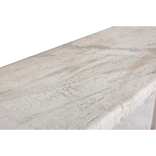 73 - A WHITE MARBLE FIREPLACE  186 cm high, 131cm wide     This carved and antique graffitied fireplace s... 