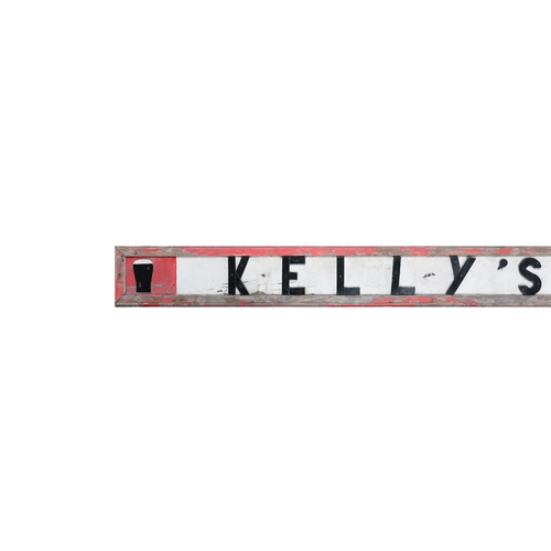 8 - AN EARLY 20TH CENTURY PITCH PINE PAINTED PUB SHOP FRONT DISPLAY FOR 'KELLY'S BAR',  360cm wide x 30c... 