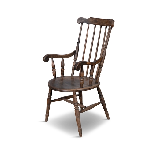 96 - A TRADITIONAL PATTERN WINDSOR STYLE CHAIR  with carved spindle back and circular panel seat on cante... 