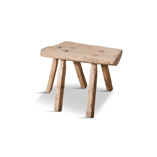 98 - A PLAIN PANEL MILKING STOOL  with five spindle supports. 34cm high, 40cm wide