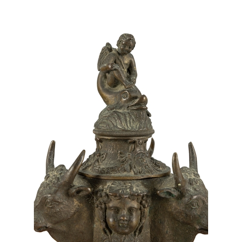 15 - A GRAND TOUR BRONZE INKPOT AND COVER, 19TH CENTURY  the cover surmounted by cupid riding a dolphin a... 