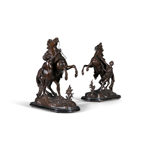 16 - AFTER COUSTEAU,   circa 1900, a pair of bronzed metal Marley horses, modelled as an attendant contro... 