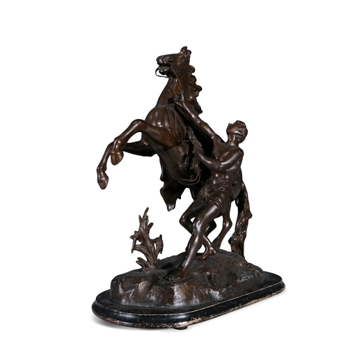 16 - AFTER COUSTEAU,   circa 1900, a pair of bronzed metal Marley horses, modelled as an attendant contro... 