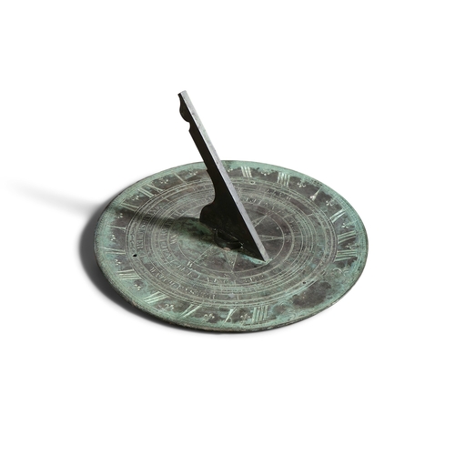 3 - A VICTORIAN BRONZE CIRCULAR SUNDIAL  the flattened panel engraved with an outer band of Roman numera... 