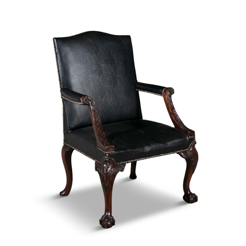 47 - A GEORGE III 'GAINSBOROUGH'  LIBRARY ARMCHAIR,  upholstered in black leather, with out scrolling lea... 