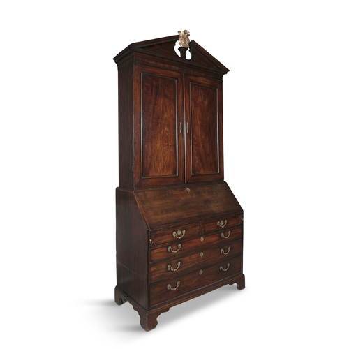 57 - A FINE IRISH GEORGE III FIGURED MAHOGANY BLIND DOOR BUREAU BOOKCASE  with an architectural pediment ... 