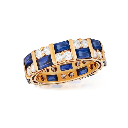 104 - A SAPPHIRE AND DIAMOND ETERNITY RING  Composed of baguette-cut sapphires with brilliant-cut diamonds... 