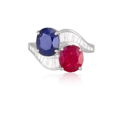 111 - A RUBY, SAPPHIRE AND DIAMOND DRESS RING  Of crossover design, set with an oval-shaped sapphire and r... 