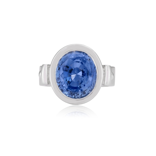 112 - A SAPPHIRE DRESS RING  The oval-shaped sapphire weighing approximately 6.50cts, within collet-settin... 