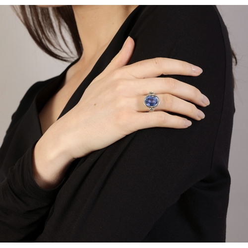 112 - A SAPPHIRE DRESS RING  The oval-shaped sapphire weighing approximately 6.50cts, within collet-settin... 