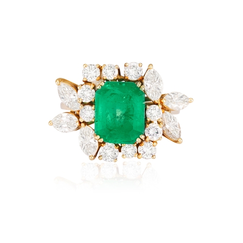 114 - AN EMERALD AND DIAMOND DRESS RING  The rectangular cut-cornered emerald weighing approximately 3.50c... 