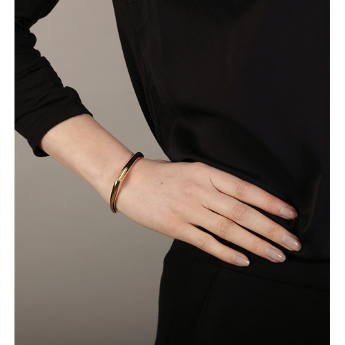 124 - A GOLD 'ROBERT MAPPLETHORPE' BANGLE, DESIGNED BY GAIA REPOSSI, FOR REPOSSI  Limited Edition, discont... 