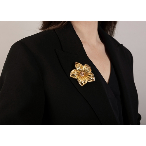 133 - A DIAMOND 'DIANA' BROOCH, BY VAN CLEEF & ARPELS, CIRCA  1990  Designed as a sculpted flowerhead, the... 