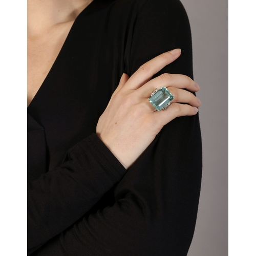 144 - AN AQUAMARINE AND DIAMOND RING  Set with a rectangular-cut aquamarine weighing approximately 30.00ct... 