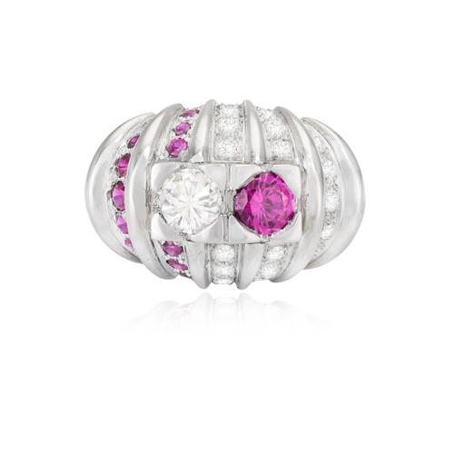 147 - A RUBY AND DIAMOND DRESS RING, CARTIER  Of domed fluted design, set with a brilliant-cut diamond and... 