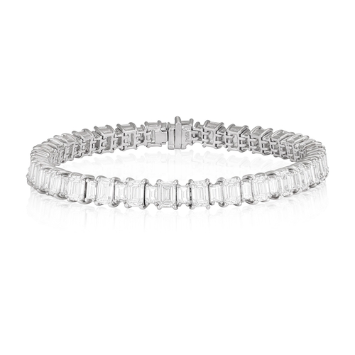 158 - A FINE DIAMOND LINE BRACELET

Composed of a continuous line of thirty emerald-cut diamonds, interspe... 