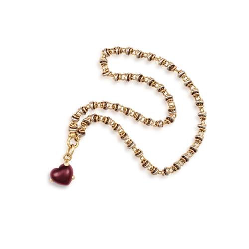 160 - A GOLD NECKLACE WITH GARNET PENDANT, BY POMELLATO  The detachable pendant set with a heart-shaped ga... 