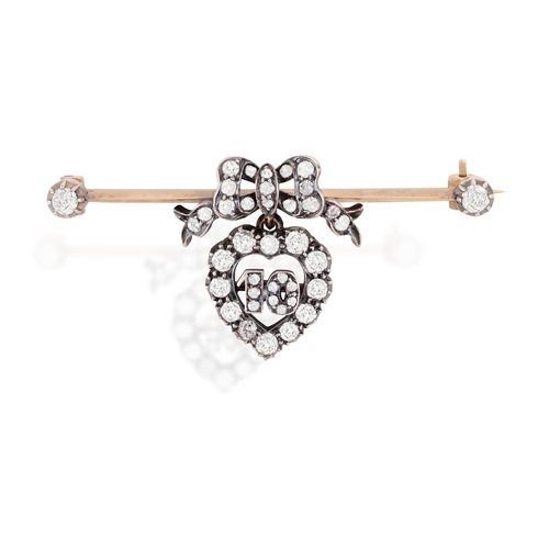 17 - A VICTORIAN DIAMOND BAR BROOCH  The bar brooch centring an old-cut diamond bow, suspending a similar... 