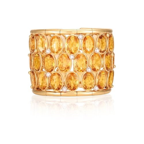 178 - A CITRINE AND DIAMOND CUFF-BRACELET  Of wide openwork design, set with oval-shaped citrines within c... 