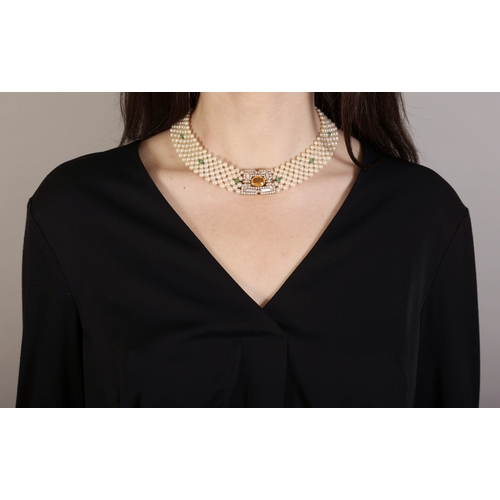 179 - A GEM-SET AND CULTURED PEARL CHOKER NECKLACE  The tapered openwork plaque centring an oval-shaped ye... 