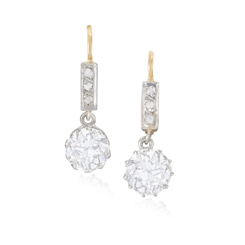 25 - A PAIR OF EARLY 20TH CENTURY DIAMOND PENDENT EARRINGS  Each set with an old European-cut diamond, we... 