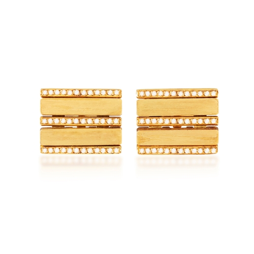 257 - A PAIR OF DIAMOND CUFFLINKS, BY FRED PARIS  The frontispiece composed of two brushed gold bars betwe... 