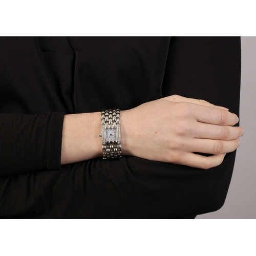 262 - A LADY'S STAINLESS STEEL, MOTHER-OF-PEARL AND DIAMOND-SET BRACELET WATCH, BY CHAUMET  Of Quartz ETA ... 