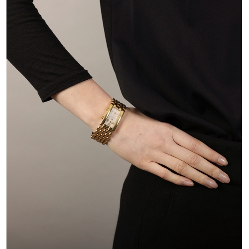 264 - AN 18K GOLD ‘TWIN TIME’ BRACELET WATCH, BY CHAUMET  2 x 5-jewel, ETA quartz movements, rectangular c... 