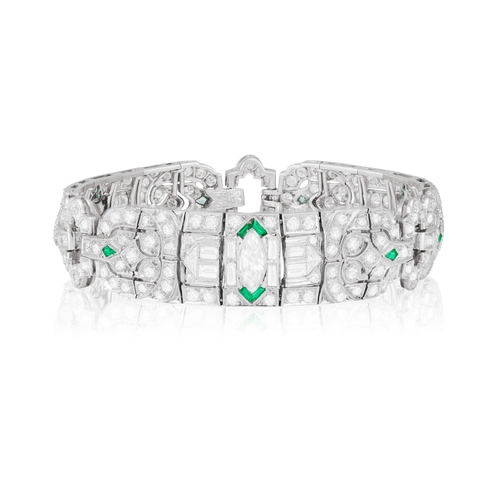 29 - A DIAMOND BRACELET  Composed of openwork motifs of geometric and foliate design, the central one cen... 