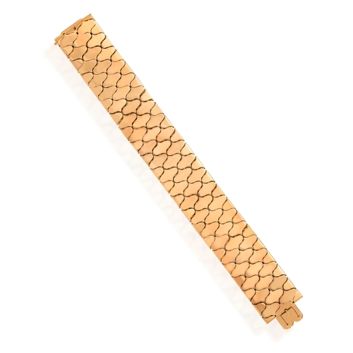 37 - A RETRO GOLD BRACELET, BY CARLO WEINGRILL, CIRCA 1955  Composed of fancy polished hinged links, in 1... 