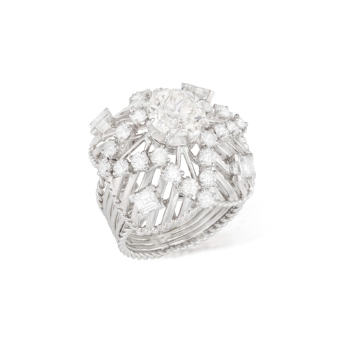 44 - A DIAMOND DRESS RING, FRENCH, CIRCA 1960  Of openwork domed design, the central old brilliant-cut di... 