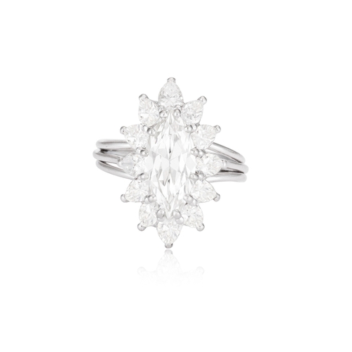 46 - A DIAMOND CLUSTER RING, CIRCA 1960  The marquise-cut diamond weighing approximately 1.50ct, within a... 