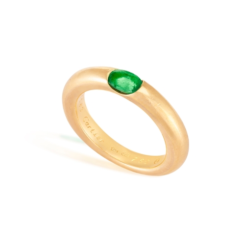 5 - AN EMERALD 'ELLIPSE' RING, BY CARTIER, 1992  The oval-shaped emerald set to a plain hoop, mounted in... 