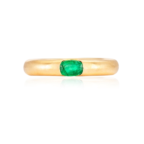 5 - AN EMERALD 'ELLIPSE' RING, BY CARTIER, 1992  The oval-shaped emerald set to a plain hoop, mounted in... 